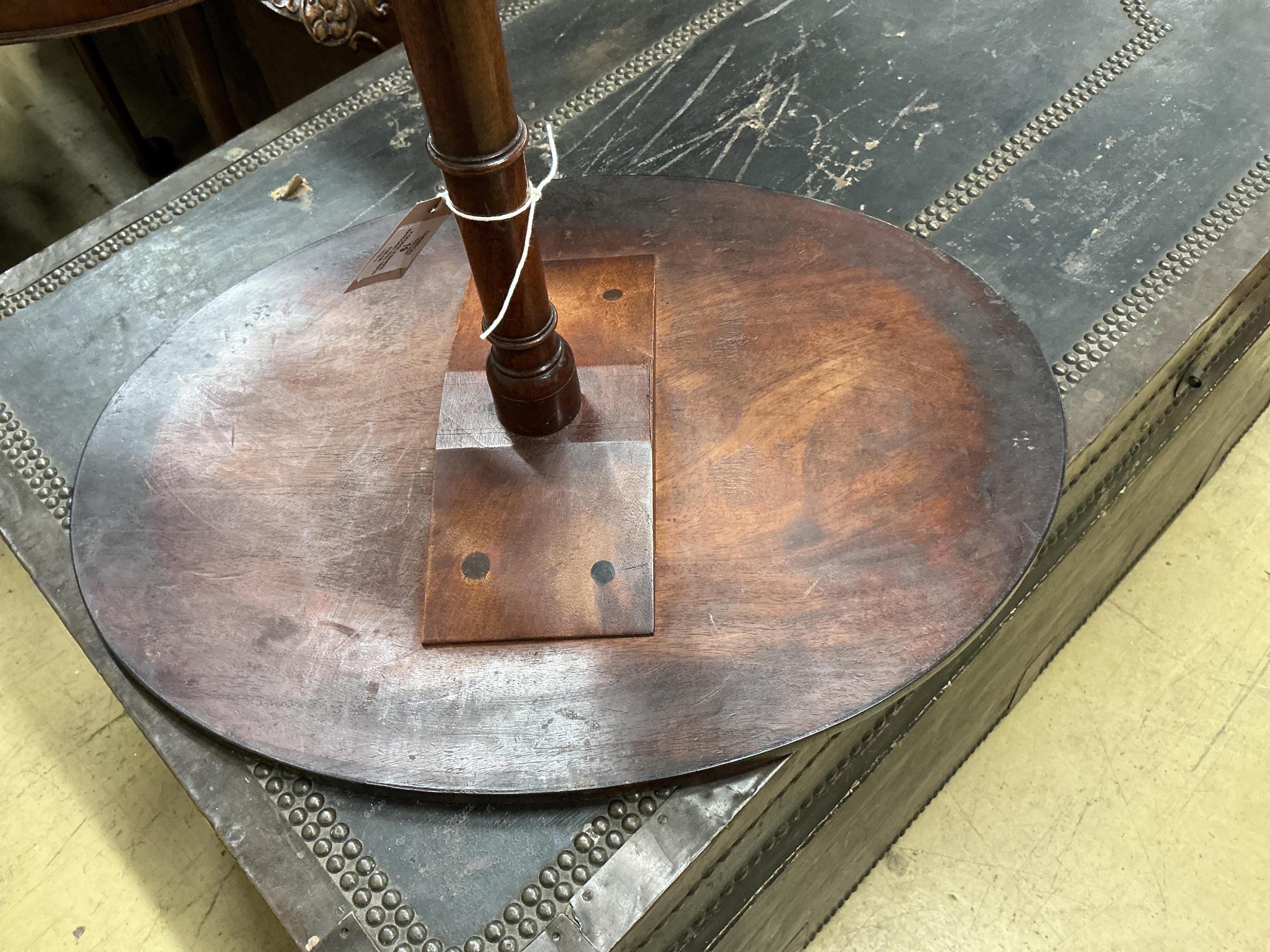 A George III banded mahogany oval tripod wine table, width 52cm, height 76cm